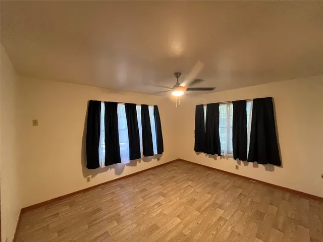 a bathroom with a sink mirror and toilet