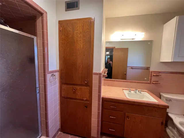 a view of a house with a yard and garage