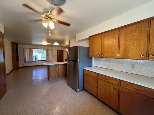 a kitchen with stainless steel appliances granite countertop a sink and cabinets