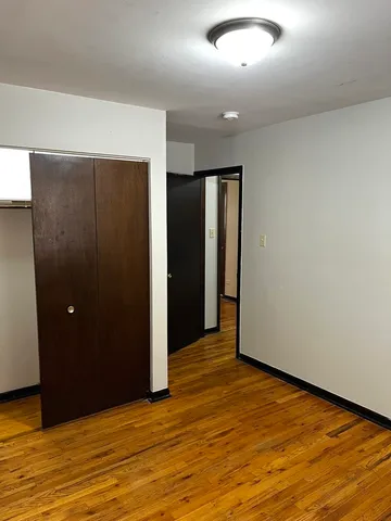 an empty room with closet area