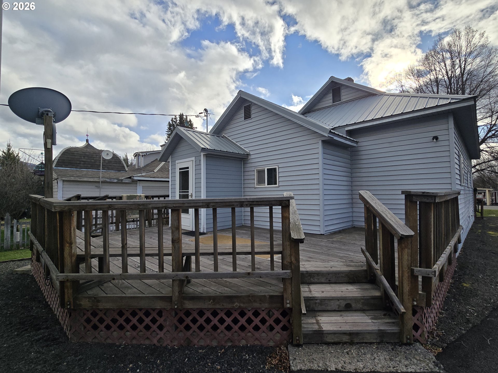 403 Southwest Depot Street Enterprise, OR 97828 - Photo 2 of 27 a front view of a house with wooden deck