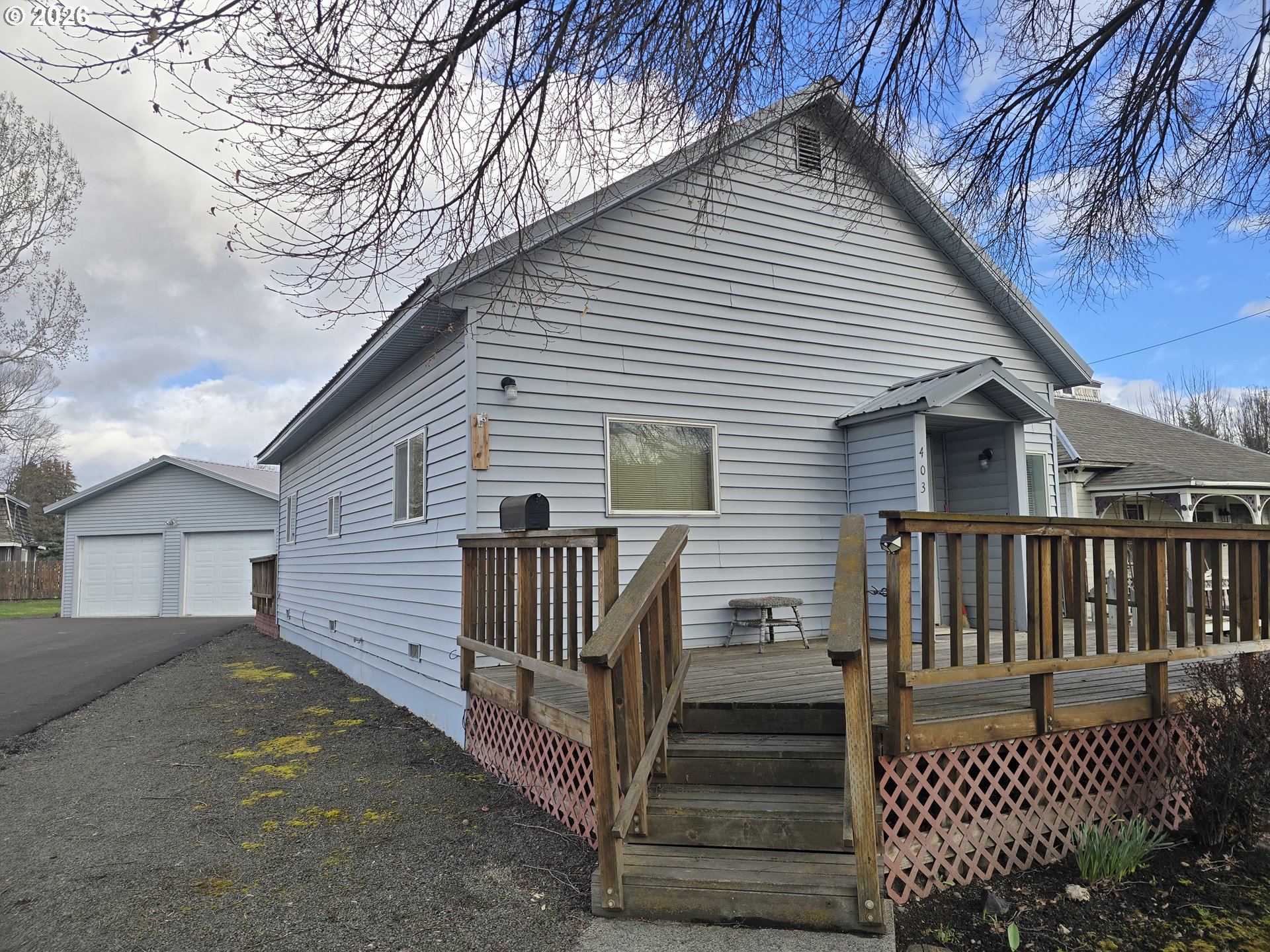 403 Southwest Depot Street Enterprise, OR 97828 - Photo 24 of 27 a view of a house with wooden fence next to a road