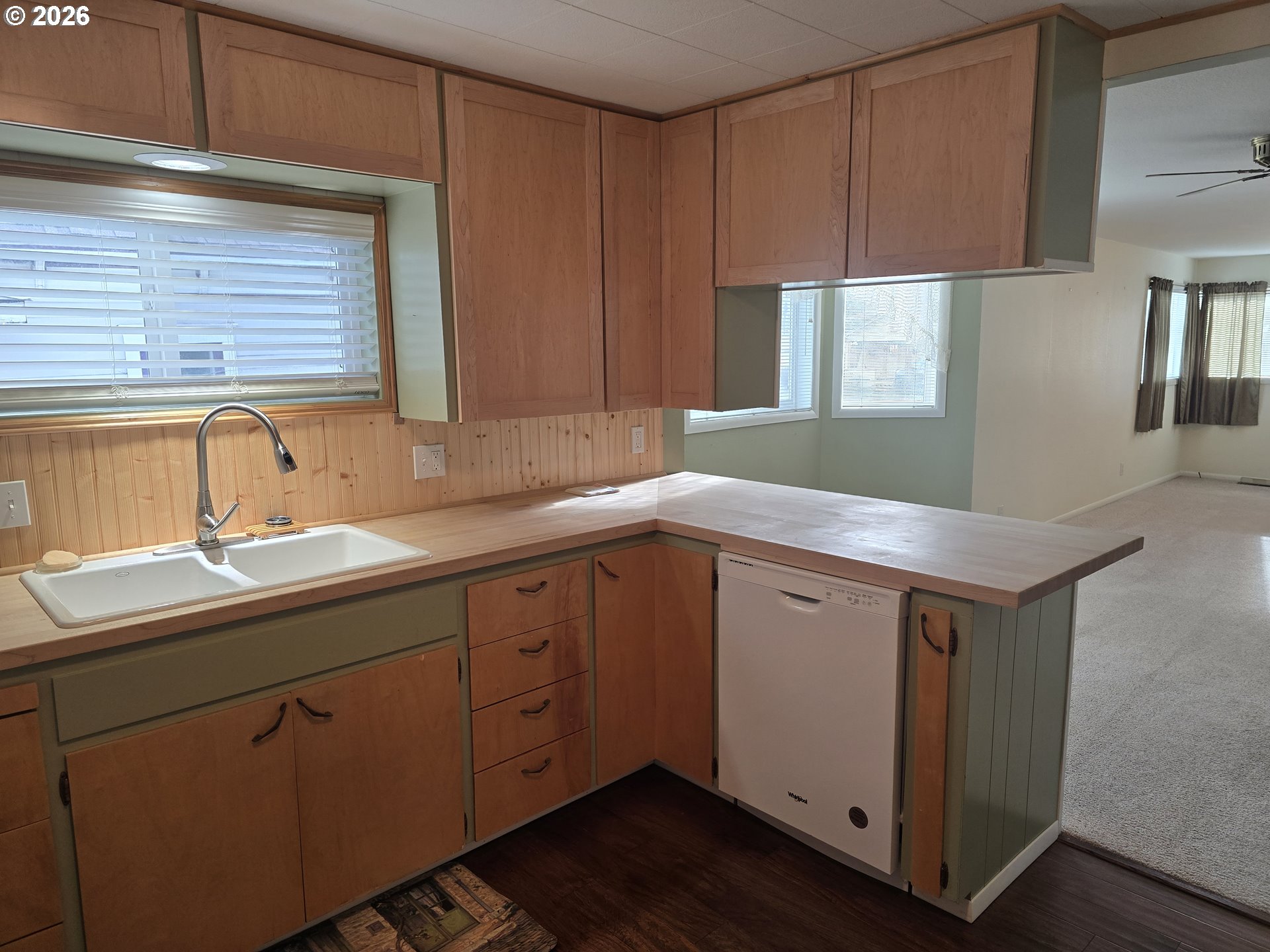 403 Southwest Depot Street Enterprise, OR 97828 - Photo 6 of 27 a kitchen with sink cabinets and wooden floor
