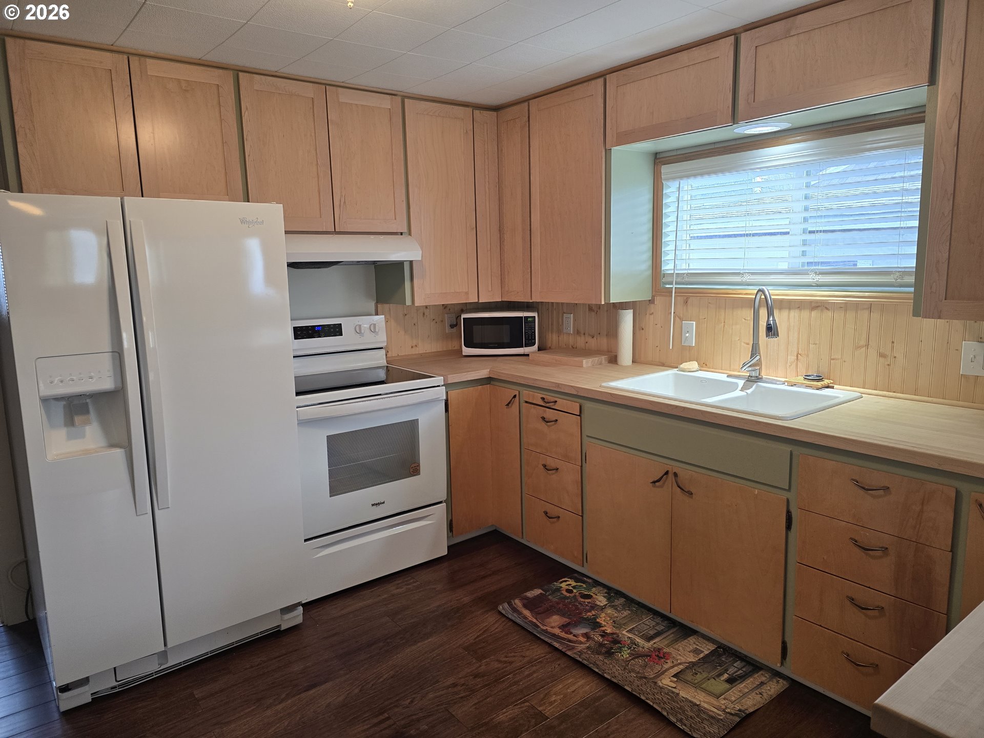 403 Southwest Depot Street Enterprise, OR 97828 - Photo 7 of 27 a kitchen with a white cabinets and white appliances