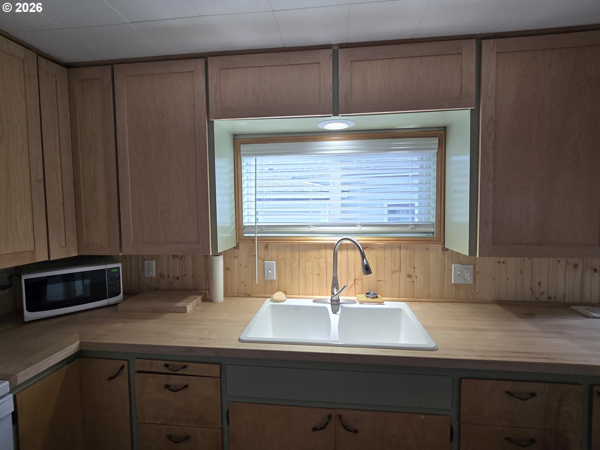 403 Southwest Depot Street Enterprise, OR 97828 - Photo 8 of 27 a kitchen with a sink and cabinets
