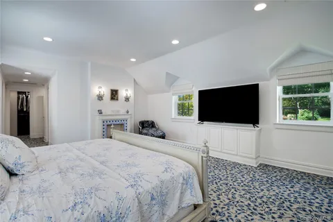 a bathroom with a large tub sink and vanity