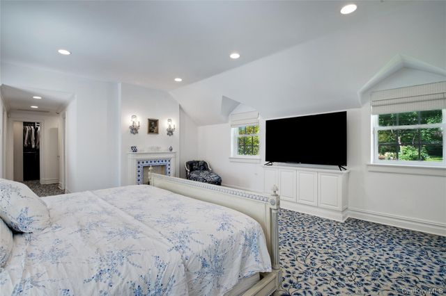 a bathroom with a large tub sink and vanity
