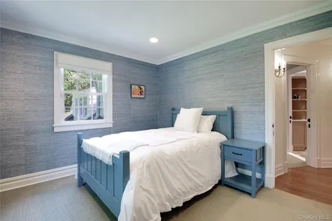 a bathroom with a bathtub sink vanity and mirror
