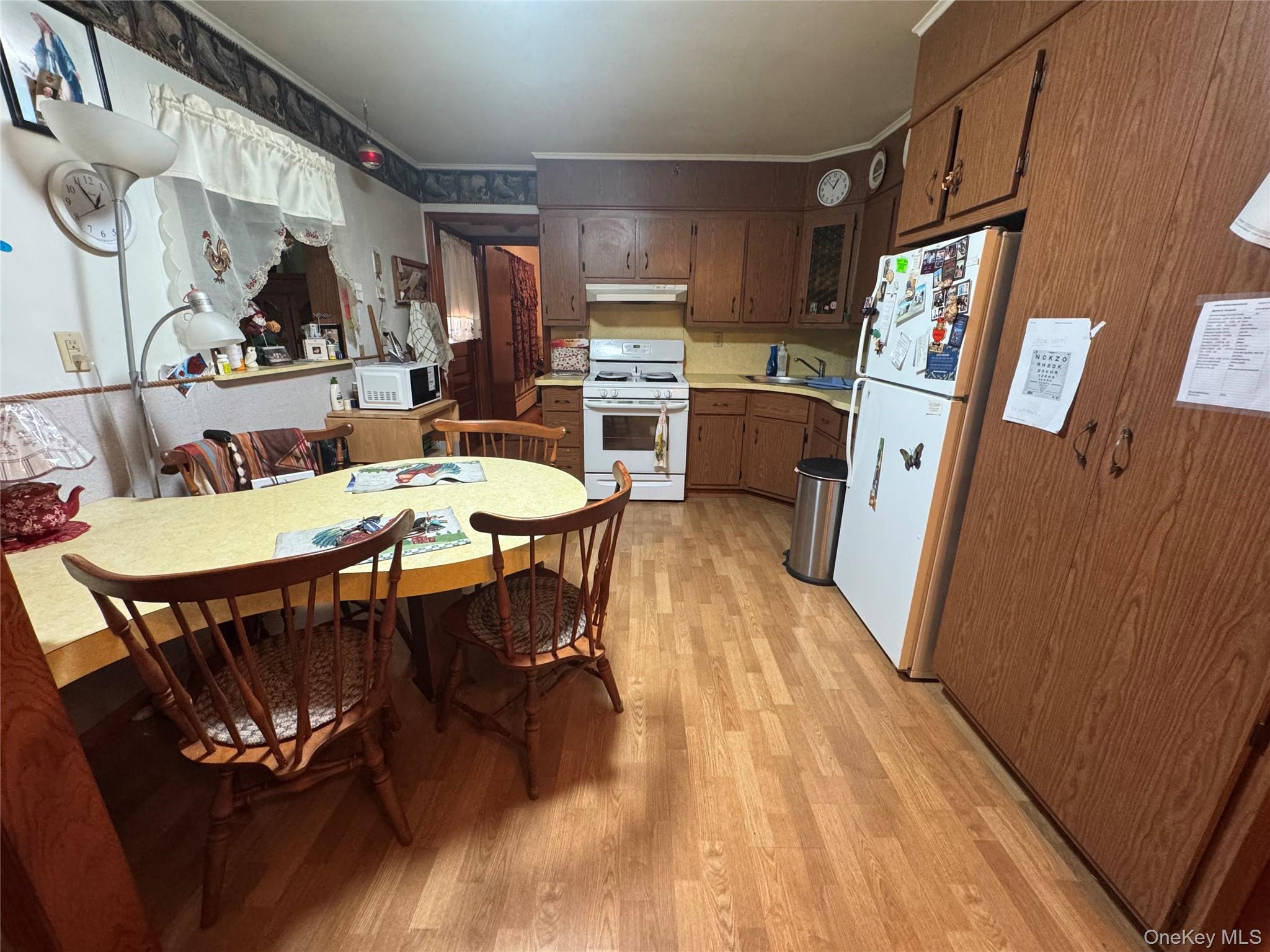 367 Mt Eve Road Goshen, NY 10924 - Photo 13 of 37 a view of a dining room with furniture window and wooden floor