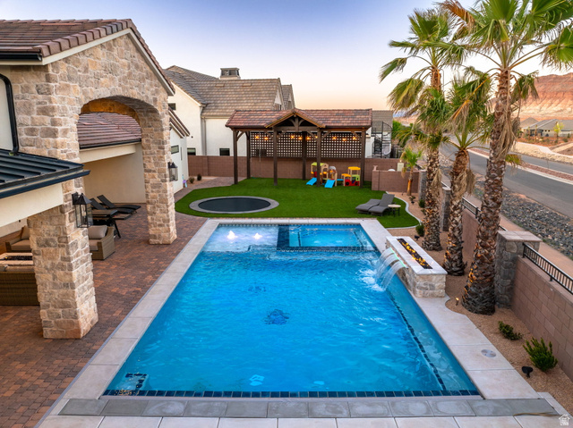 4871 South Homestead Way Washington, UT 84780 - Photo 133 of 151 Integrated pool / hot tub featuring a fenced backyard and a patio area