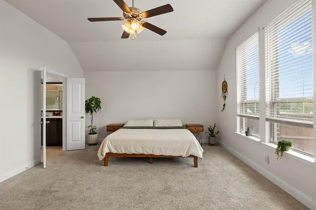 a bed room with a bed and a chandelier