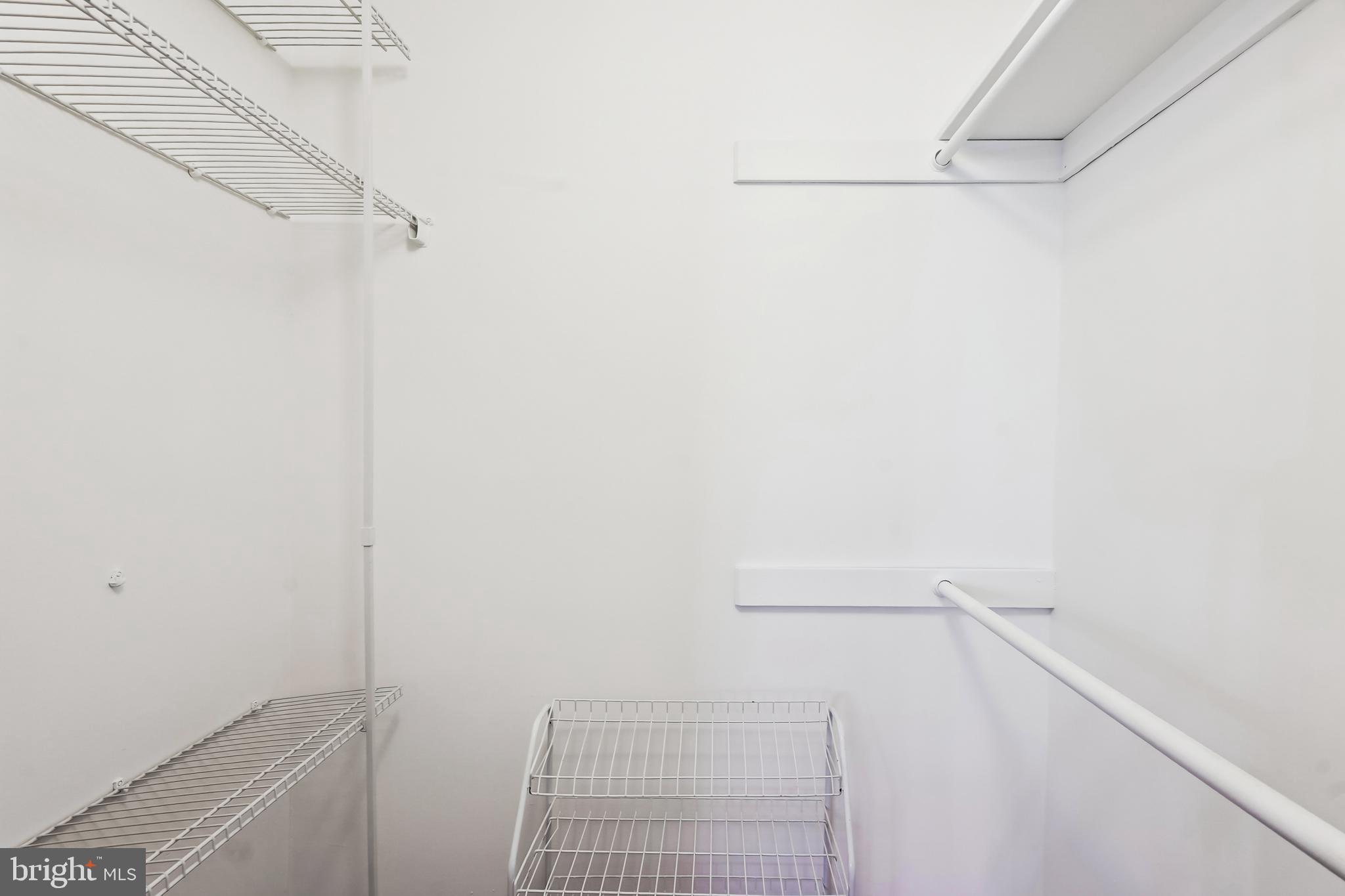 4500 South Four Mile Run Drive, Unit 129 Arlington, VA 22204 - Photo 16 of 34 a view of a room with racks on the wall