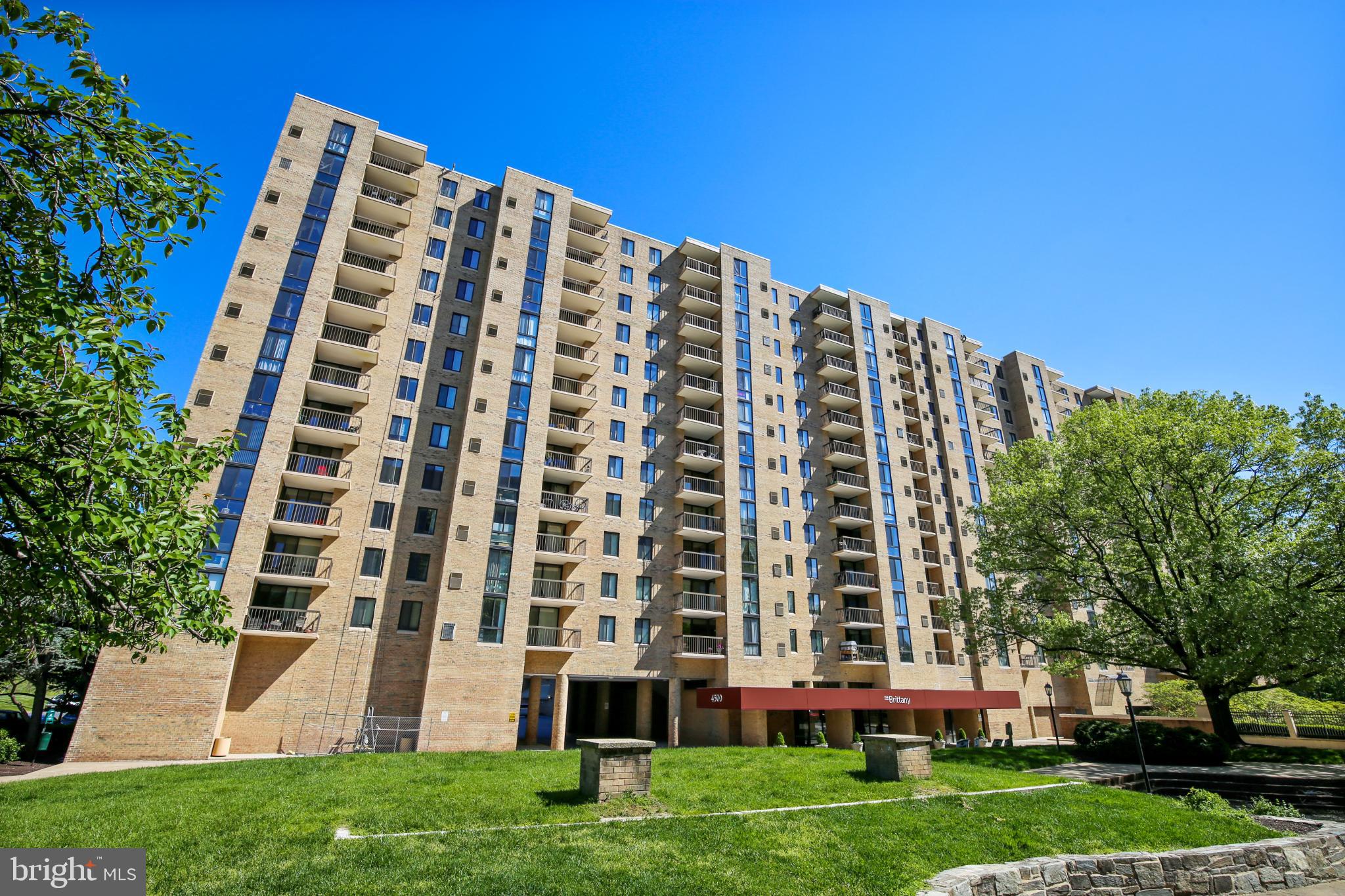 4500 South Four Mile Run Drive, Unit 129 Arlington, VA 22204 - Photo 19 of 34 front view of a building with a yard
