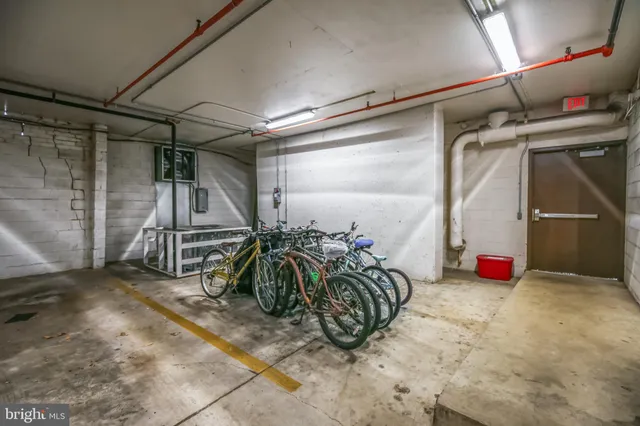 a view of parking garage with cars