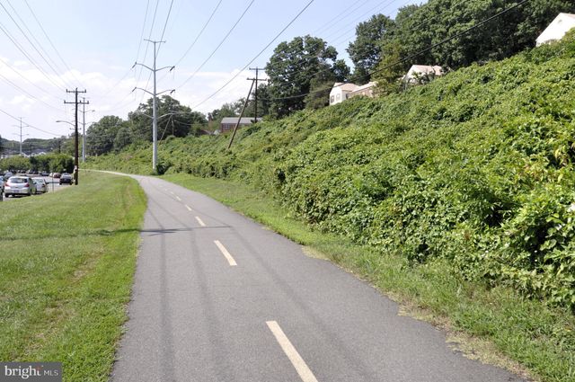 a view of a room with rack and bicycle