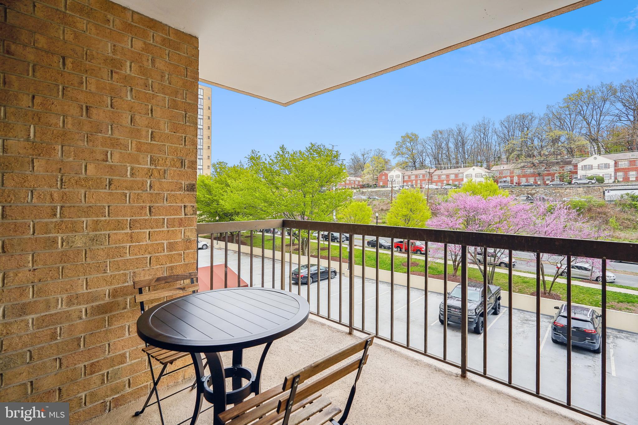 4500 South Four Mile Run Drive, Unit 129 Arlington, VA 22204 - Photo 7 of 34 a view of a balcony with furniture and a floor to ceiling window