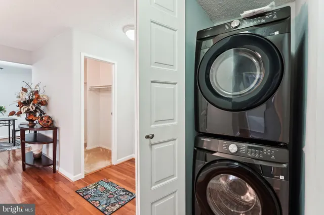 a view of a hallway with washer and dryer