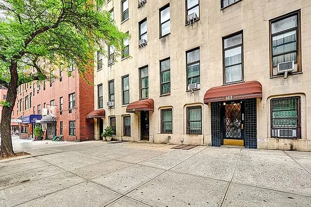 a bathroom with a double vanity sink toilet and shower