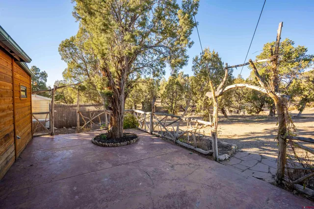 a view of a backyard with sitting area