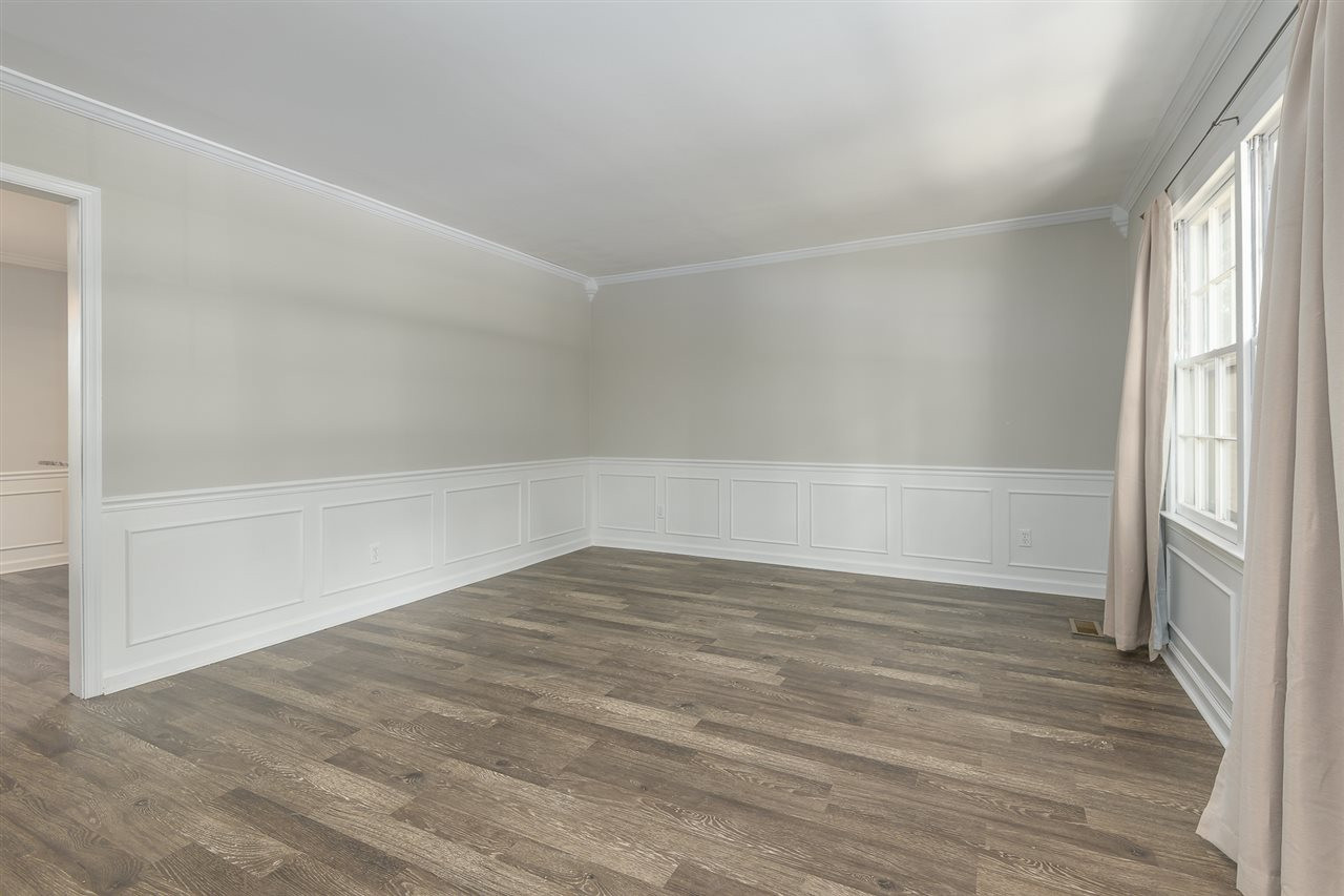 7509 Mine Valley Road Raleigh, NC 27615 - Photo 4 of 24 a view of an empty room with a window