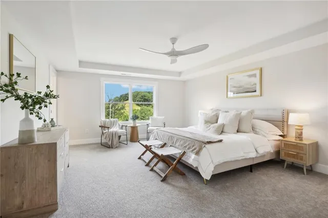 a spacious bedroom with a bed and a couch