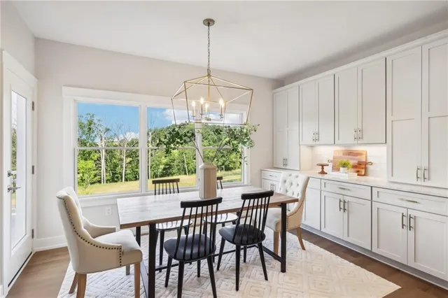 a view of a dining room with furniture window and outside view