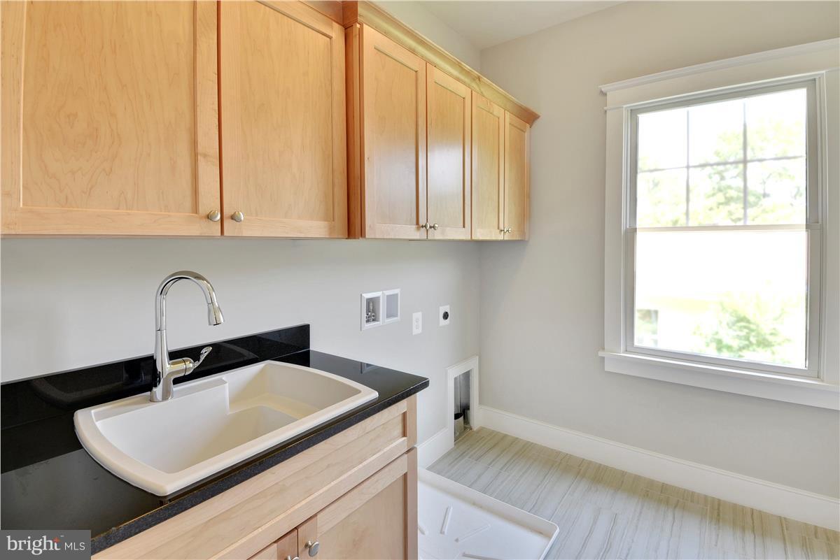 607 Kingsley Road Southwest Vienna, VA 22180 - Photo 21 of 30 Upper Level Laundry Room