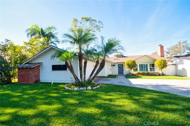 a front view of house with yard and entertaining space