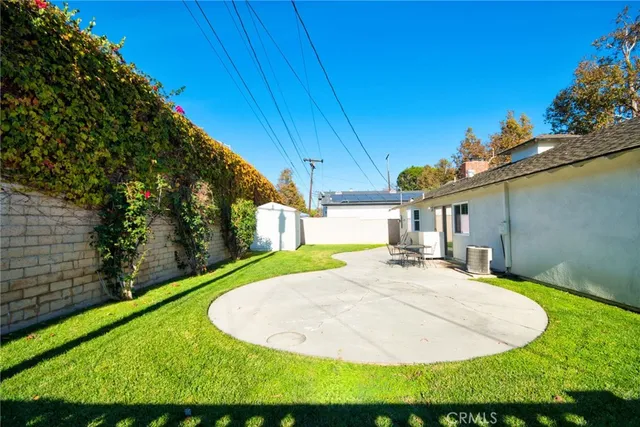 a view of a backyard with a patio