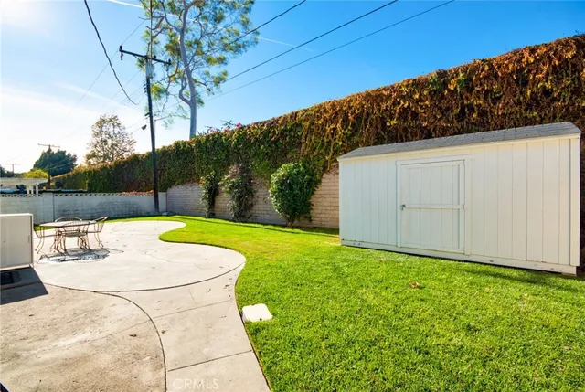 a view of a backyard with potted plants
