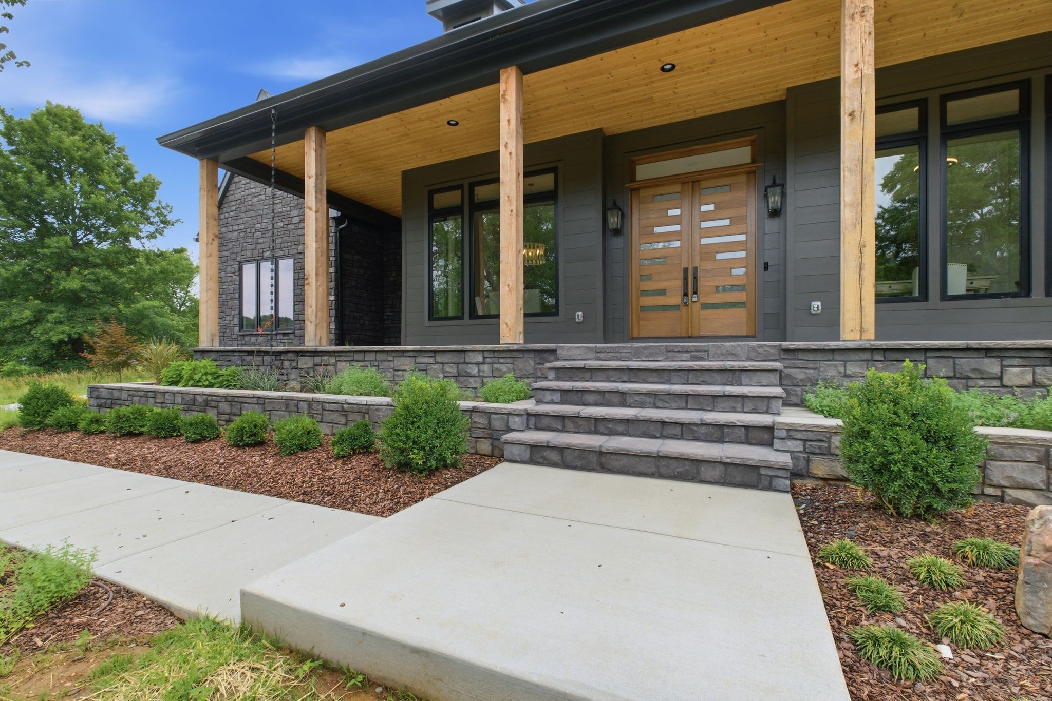 1002 Waller Road Brentwood, TN 37027 - Photo 2 of 54 a front view of a house with a garden
