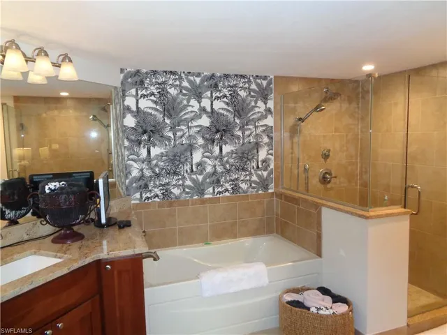 a bathroom with a bathtub and a sink