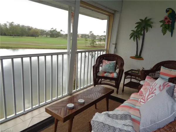 a view of a balcony with chair and table