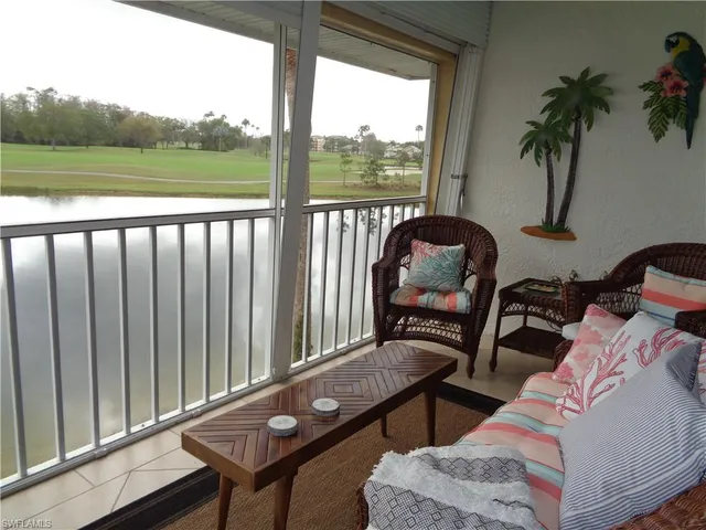 a view of a balcony with chair and table