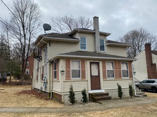 a front view of a house with a yard