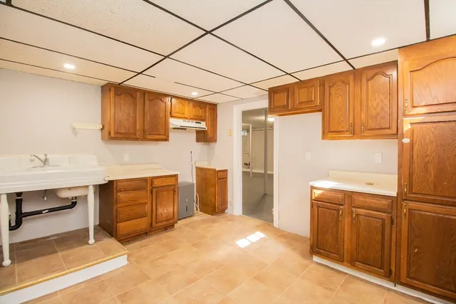 a kitchen with a sink cabinets and appliances