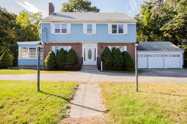 a front view of a house with yard