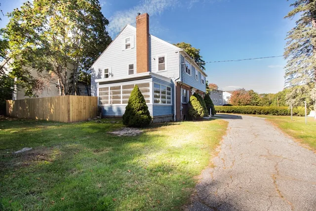 a view of a house with a yard