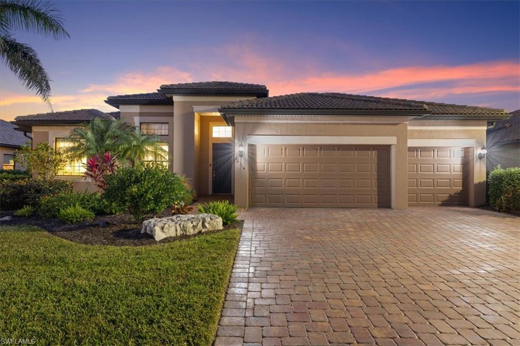 20114 Eagle Stone Drive Estero, FL 33928 - Photo 1 of 4 a front view of a house with a yard