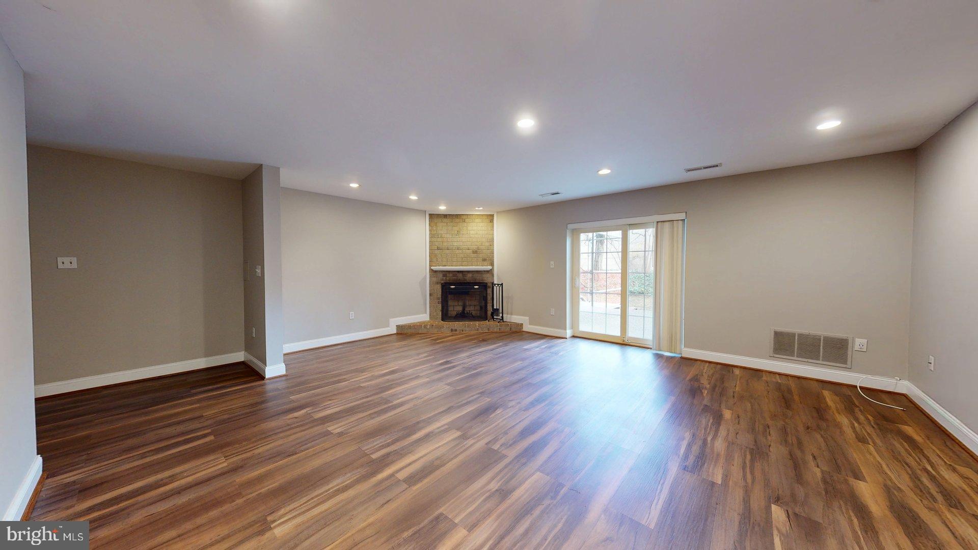 951 South Rolfe Street, Unit 1 Arlington, VA 22204 - Photo 2 of 18 a view of empty room with wooden floor
