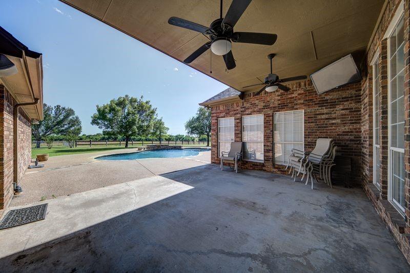 334 Farm To Market Road 2264 Decatur, TX 76234 - Photo 12 of 40 a view of a garage with a table and a fireplace