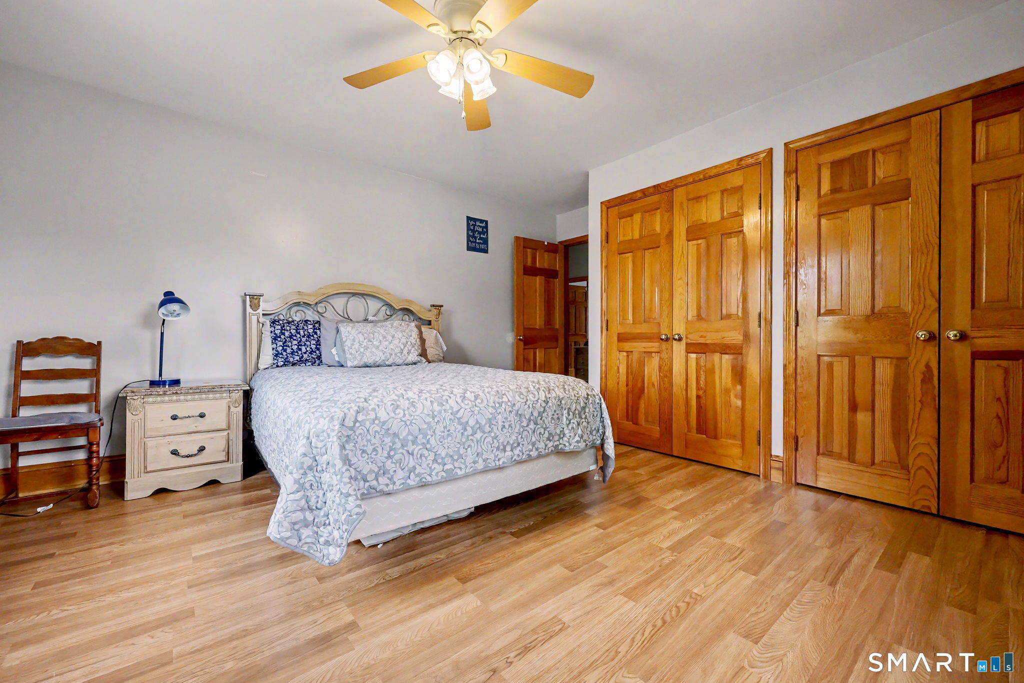 7 Merrill Road Trumbull, CT 06611 - Photo 28 of 40 a bedroom with a bed and wooden floor