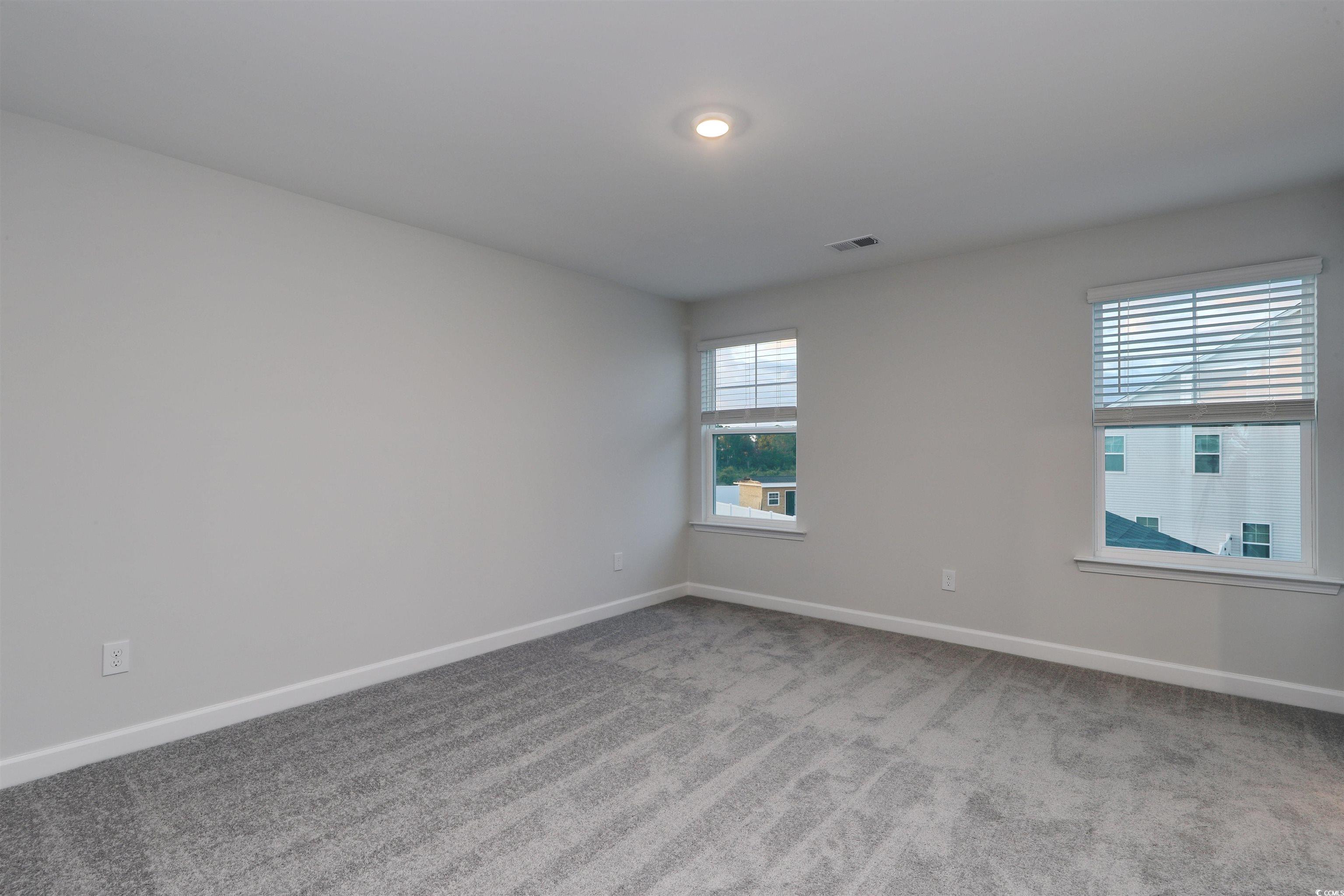 3121 Visionary Drive Myrtle Beach, SC 29588 - Photo 23 of 33 Empty room featuring light colored carpet and baseboards