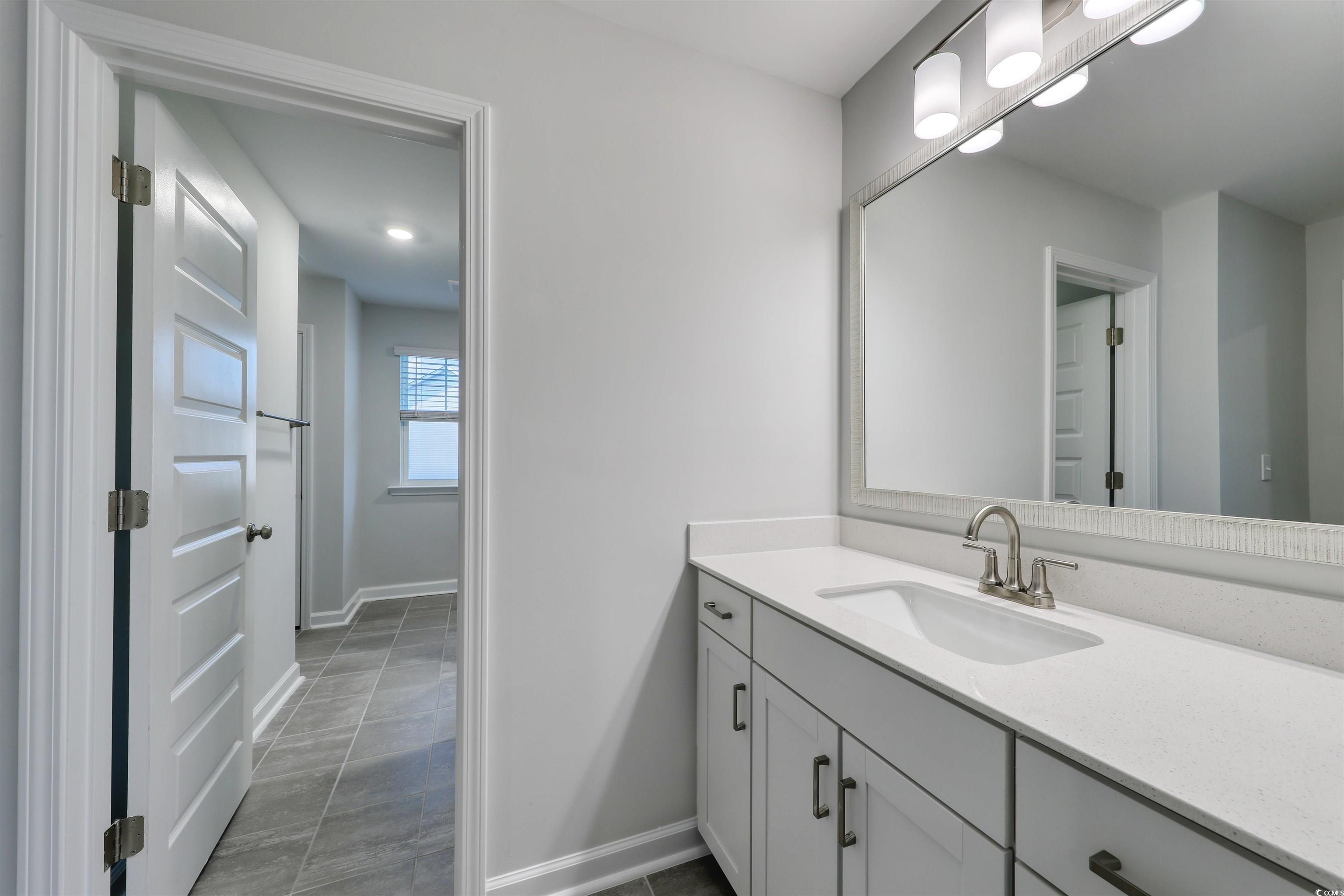 3121 Visionary Drive Myrtle Beach, SC 29588 - Photo 24 of 33 Bathroom with vanity and light tile patterned flooring