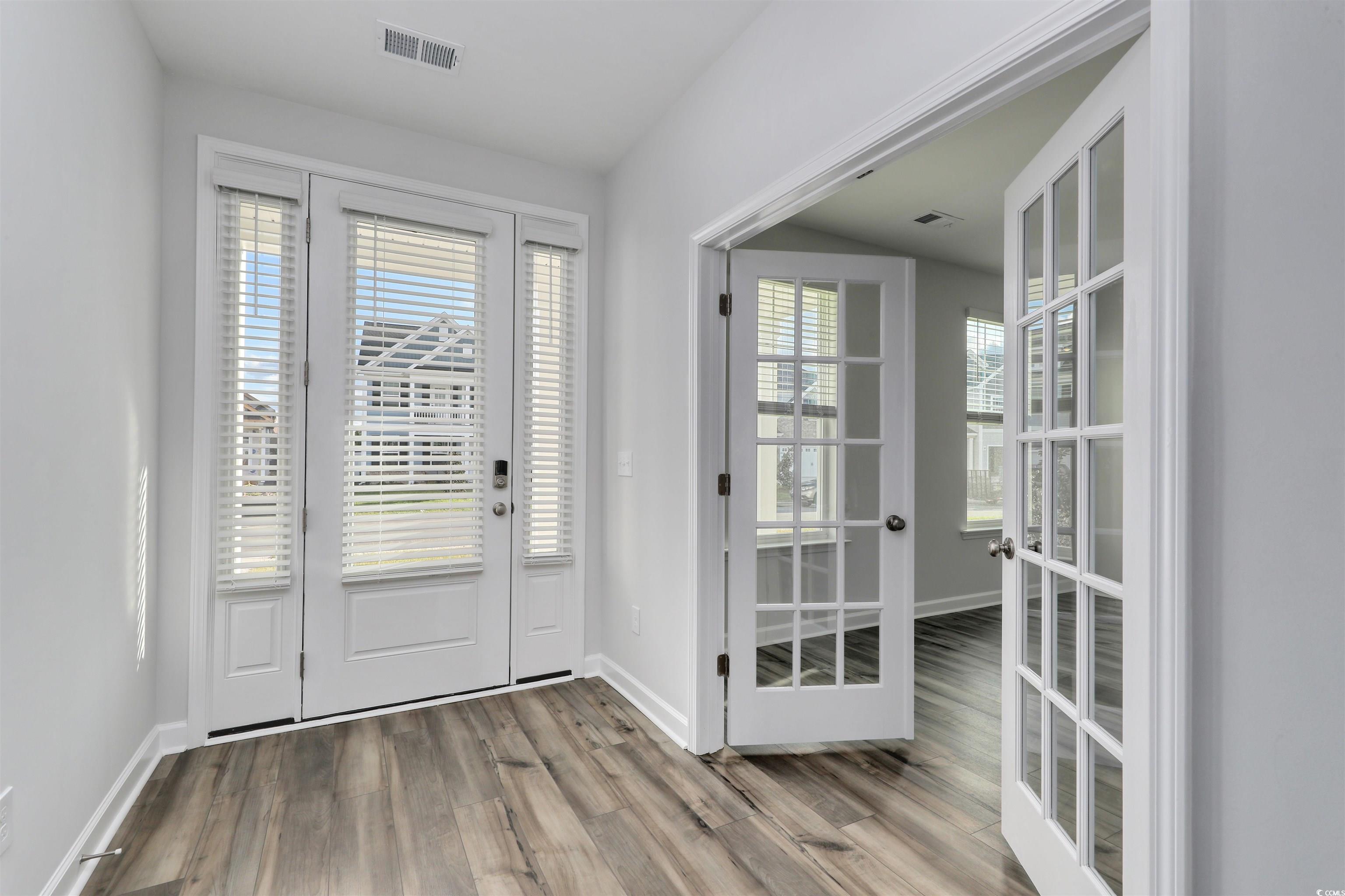 3121 Visionary Drive Myrtle Beach, SC 29588 - Photo 3 of 33 Doorway featuring wood finished floors and baseboards