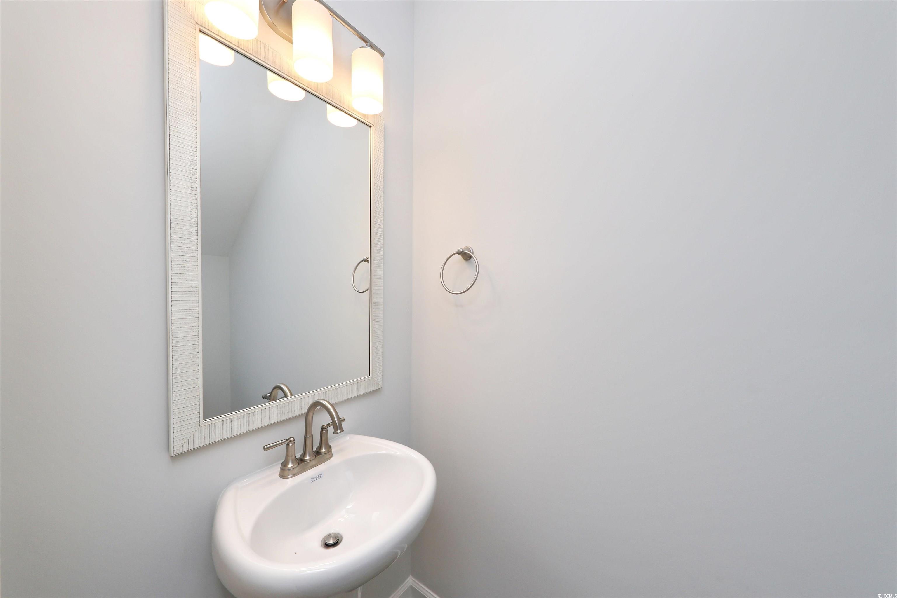 3121 Visionary Drive Myrtle Beach, SC 29588 - Photo 33 of 33 Bathroom featuring a sink and baseboards