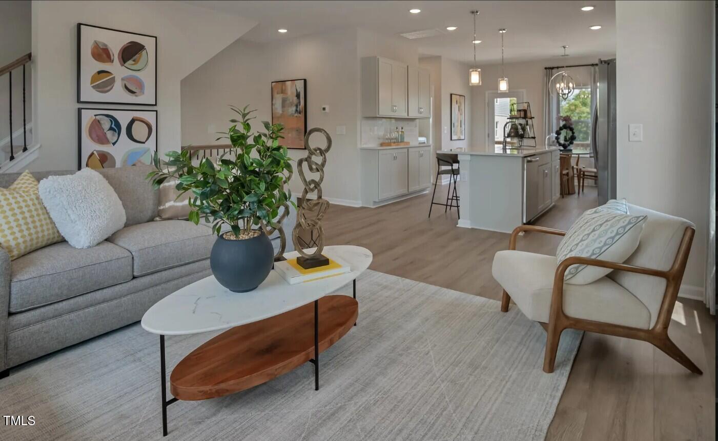 726 Orch Vista Circle Raleigh, NC 27606 - Photo 6 of 16 a living room with furniture kitchen view and a table