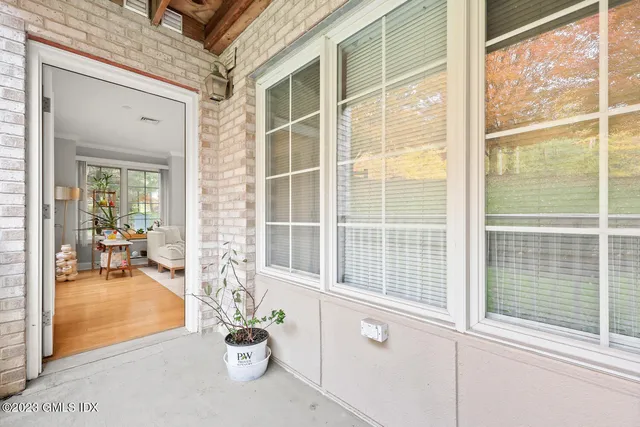 a view of a living room and a window and chair