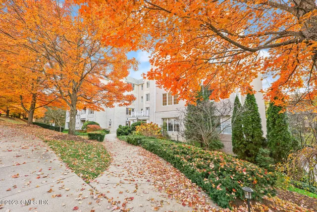 a pathway of a house with a yard