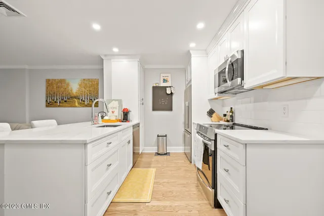 a kitchen with a stove and a sink